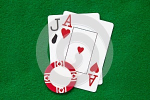 Blackjack hand on green table