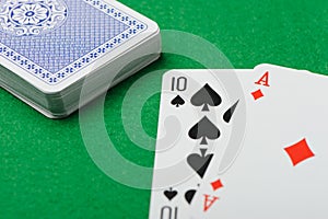 Blackjack.Playing cards on a green background