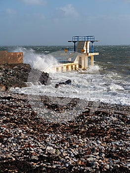 Blackrock public diving board at storm,