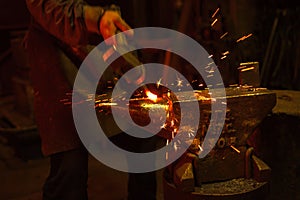 Blacksmith forfing hot iron