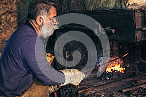 Blacksmith forge iron at work