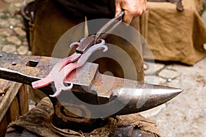 Blacksmith forged iron smith anvil hammerman photo