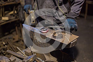 Blacksmith forging molten metal