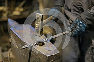 Blacksmith forging molten metal