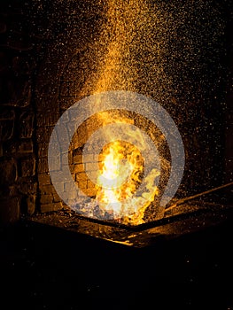 .Blacksmith forging in the traditional way, as in the past
