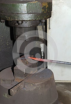 Blacksmith hammering hot iron