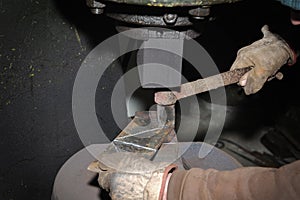 Blacksmith hammering hot iron