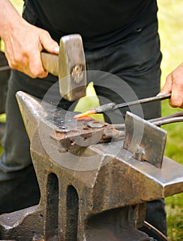 Blacksmith hammering hot steel