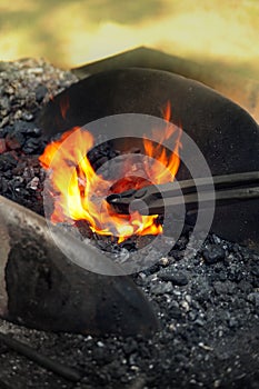 Blacksmith heating up iron