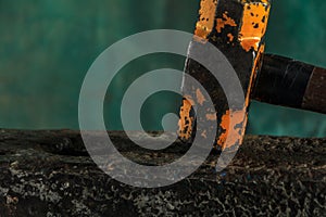 The blacksmith manually forging the molten metal on the anvil in