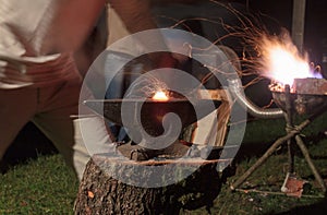 Blacksmith minting metal table photo