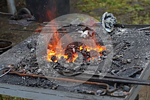 Blacksmith portable furnace with burning coals