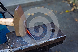 Blacksmith's tools. Anvil, pliers, hammer, fire, iron