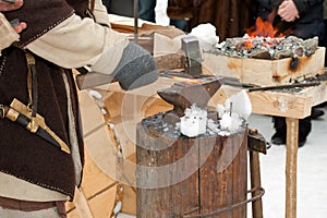 Blacksmith at work with hot iron