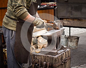 Blacksmith working with anvil