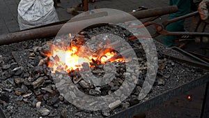 Blacksmith working with molten iron