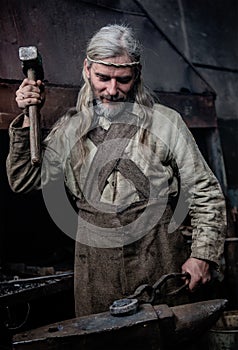 Blacksmith working in the smithy