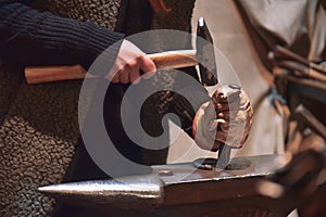 Blacksmith working in the workshop