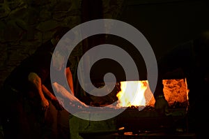 The blacksmith works at night