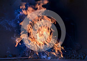 Blacksmiths fire burning hot on coals