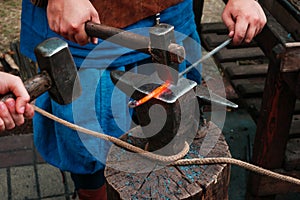 Blacksmiths forging heated metal