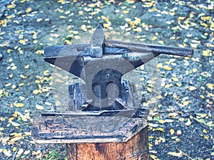 Blacksmiths tools. Kraft hammer lies on the anvil against