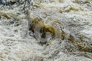 Blackstone River surface roiled into chaos