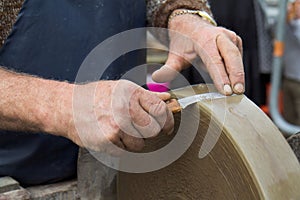 Blade against a grindstone photo