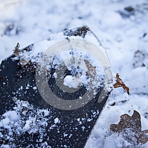 Blade of a sapper shovel against the background of snow