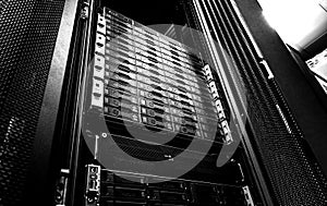 Blade server in rack cluster hard drives storage in internet data center room black and white tone