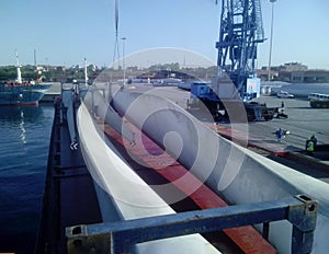 Blades of the wind farm are fixed on the deck of the ship