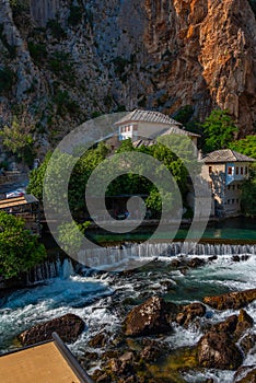 Blagaj Tekke - Historic Sufi monastery built on the cliffs by th photo