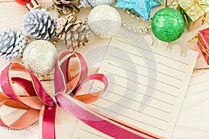 Blan brown paper for your text with red ribbon and christmas dec
