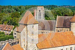 Blandy-les-Tours castle walls over Saint-Maurice church, France