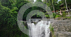 Blangsinga waterfall, Bali. Aerial view of a lush waterfall in a forest