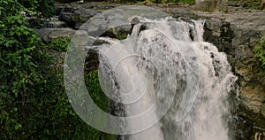 Blangsinga waterfall, Bali. Aerial view of a lush waterfall in a forest