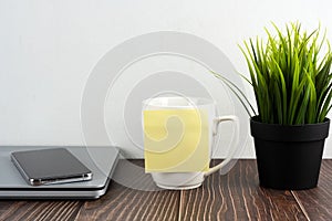 Blank adhesive note on cup of coffee with copy space
