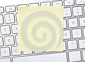 Blank adhesive note on keyboard
