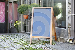 Blank advertising board on city street