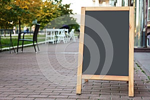 Blank advertising board on city street