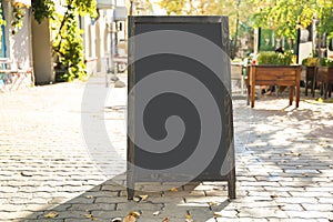 Blank advertising board on city street