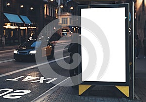 Blank advertising light box on bus stop, mockup of empty ad billboard on night bus station, template banner on background city photo