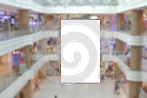 Blank advertising poster banner mockup in modern retail environment; vertical hanging billboard in shopping mall, out-of-home OOH