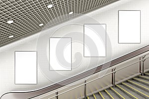 Blank advertising poster on underground escalator wall