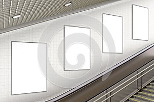 Blank advertising poster on underground escalator wall