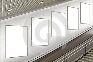 Blank advertising poster on underground escalator wall