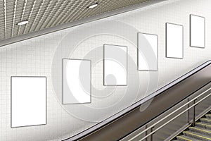 Blank advertising poster on underground escalator wall