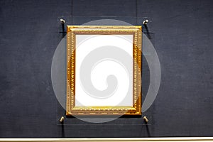 Blank antique golden carved picture frame on wall