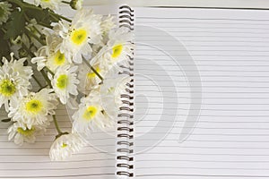 Blank area note book or diary with flower