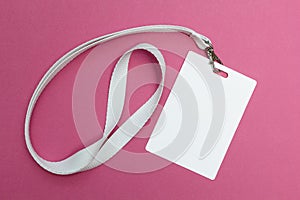 Blank badge mockup isolated on pink. Plain empty name tag with string